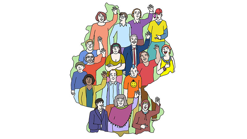 Symbolbild: Gruppe an Menschen auf einer Umgebungskarte