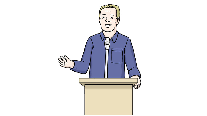 Die Illustration zeigt einen Mann hinter einem Rednerpult. Der Mann hat blonde Haare und trägt ein dunkelblaues Hemd. Er spricht in das Mikrofon.