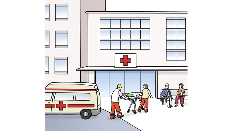 Die Illustration zeigt eine Szene vor einem Krankenhaus. Das zentrale Gebäude ist klar als Krankenhaus erkennbar durch das große rote Kreuz über dem Eingang.  Es hat mehrere Fenster. Links im Bild steht ein Rettungswagen (Krankenwagen) mit einem roten Kreuz.
