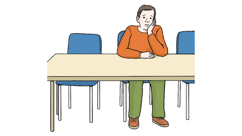 Illustration eines jungen Mannes, der mit trauriger Mine alleine an einem Tisch sitz.